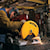 Chop Saw with QUIK-CHANGE™ Keyless Blade Change System blade being used to slice a metal rod