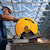 Chop Saw with QUIK-CHANGE™ Keyless Blade Change System being used by a person to cut metal rod