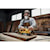 User sanding a wood board with the DCW220B and DCB205 battery attached 