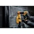 DEWALT Hammer Drill powered by a 20V 2Ah battery, used by a man with gloves on a concrete wall with a DEWALT Dust Extraction System.