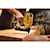 XR 18 GA Cordless Narrow Crown Stapler in action on a wooden board at a construction site