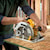 7 and one quarter inch lightweight circular saw sawing through a wooden sheet.