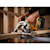 Brushless cordless circular saw cutting wooden beam.