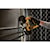Xtreme 12 volt 1 and three quarter inch brushless cordless band saw tool being used to cut metal.