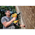 21 inch Plastic Collated Cordless Nailer in action by a construction worker on a wooden wall