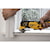 XR Cordless Oscillating Multi Tool being used by person to trim a wooden window frame