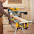 Double bevel sliding compound miter saw being used by a person to cut wood.