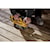User sanding a wooden staircase with the DCW220B and the DCB205 battery