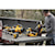 Lithium ion hedge trimmer being placed in truck bed full of gardening power tools
