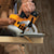 7 and one quarter inch lightweight circular saw sawing through a wooden board.