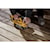 User sanding an outdoor wooden deck with the DCW220B and the DCBP520 battery attached 