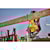 Rafter hook feature of FLEXVOLT cordless worm drive style saw hanging tool by wooden beam.